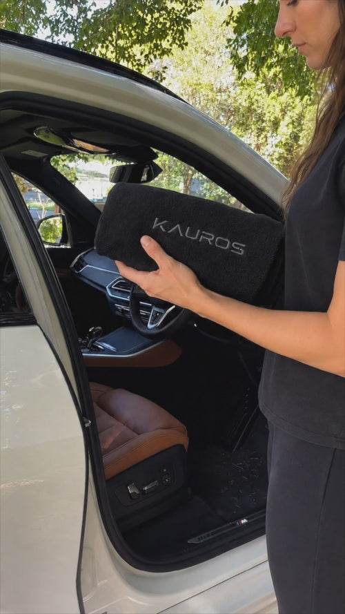 Premium waterproof car seat cover installation and protection demonstration in a luxury vehicle
